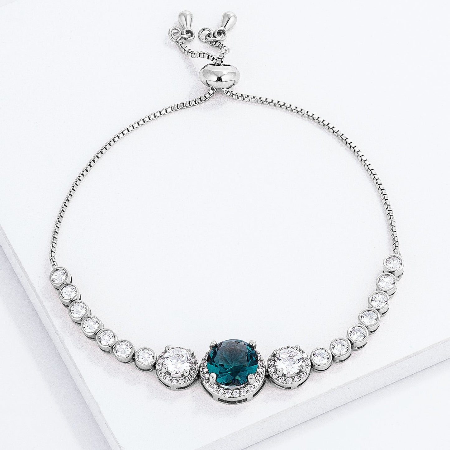 Adjustable Teal Rhodium Plated Graduated CZ Bolo Style Tennis Bracelet